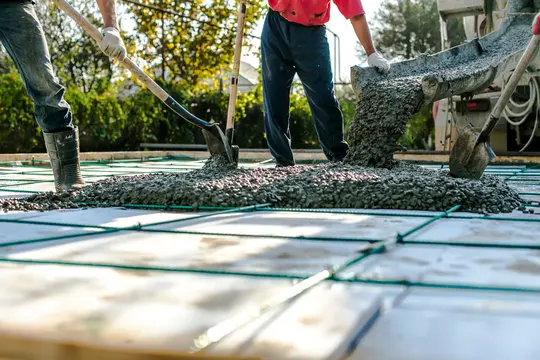 Concrete foundation pouring for projects managed by construction estimating companies in Alaska.